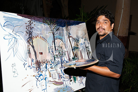 Javier García (pintor) haciendo cuadro de evento